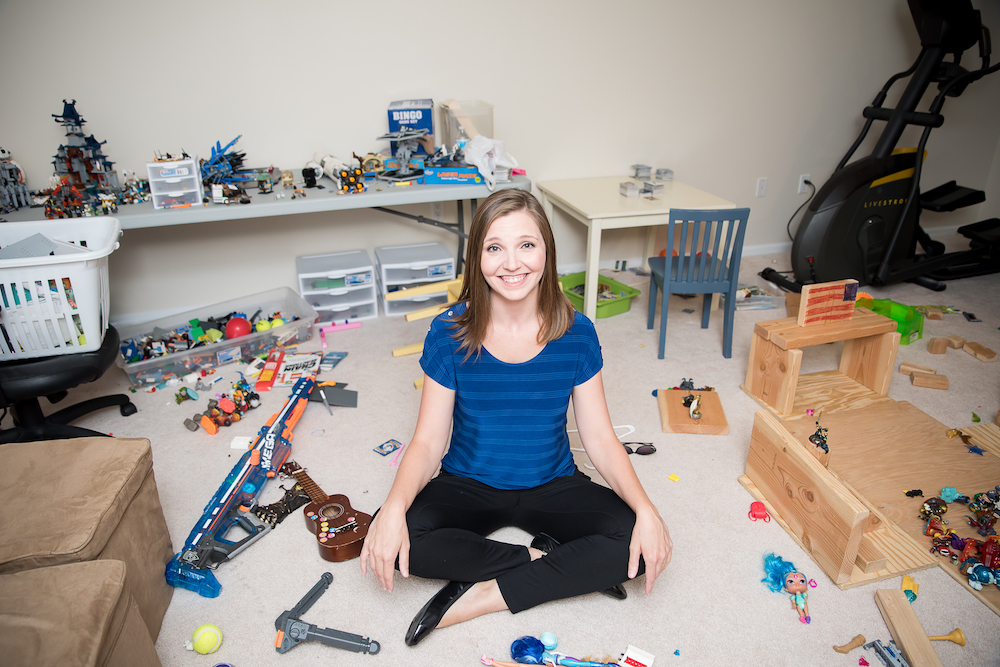 parenting struggles - Mom sitting in room with toys all over the floor